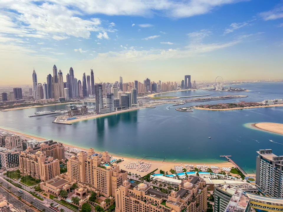 Oblique aerial view of Dubai Marina towers and the coast